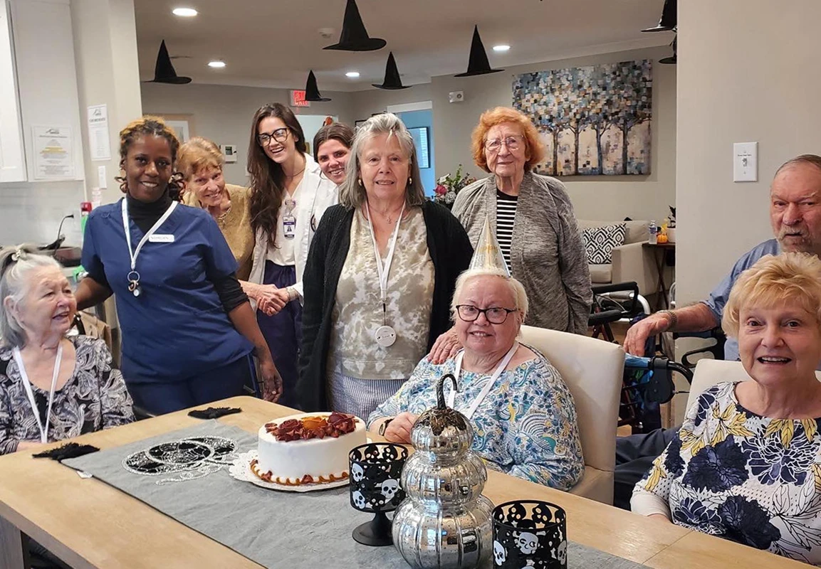 Audubon Care Homes seniors and caregiver reunited celebrating a birthday