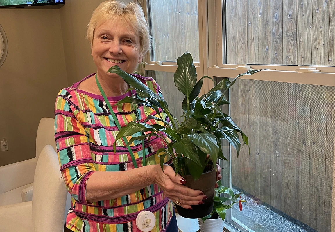 Audubon Care Homes Senior lady with a plant