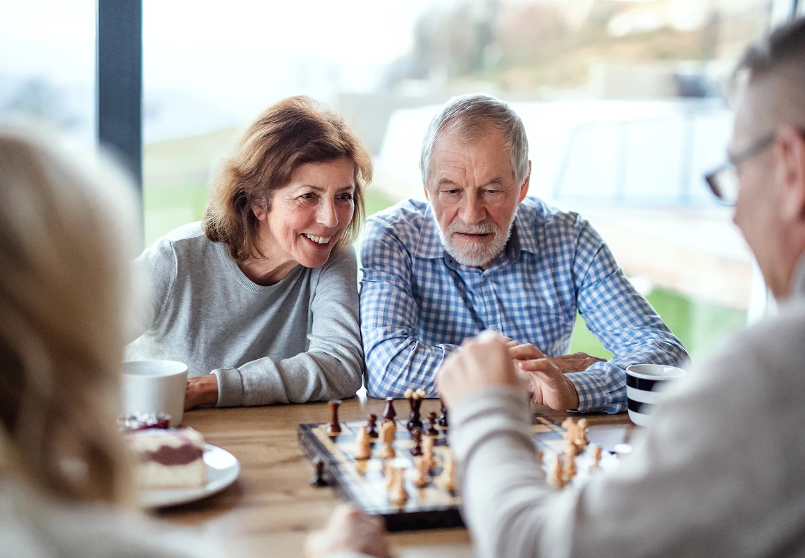 Audubon Care Homes Family playing chess